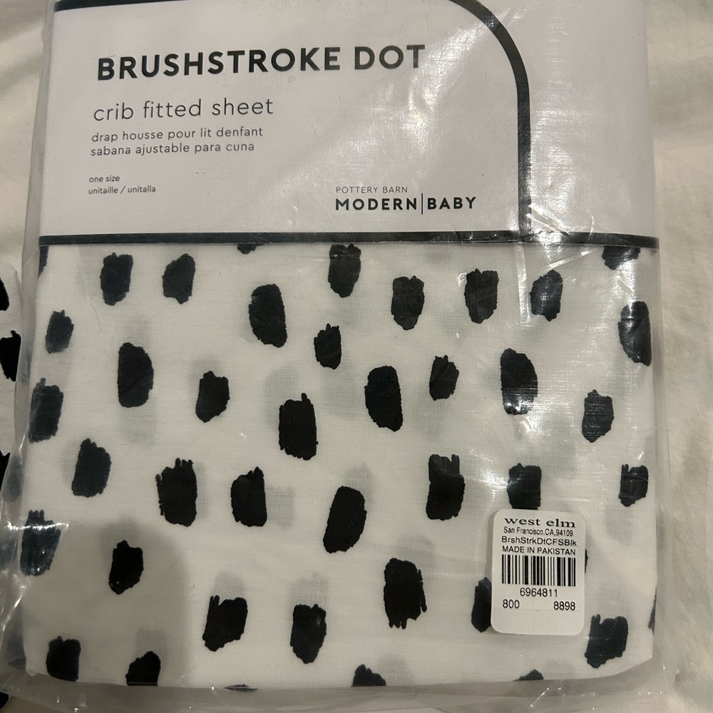 NWT and lightly used West Elm crib sheets